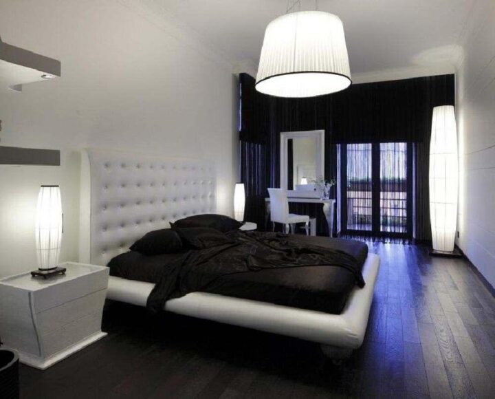 Спальня с темным полом и белой мебелью