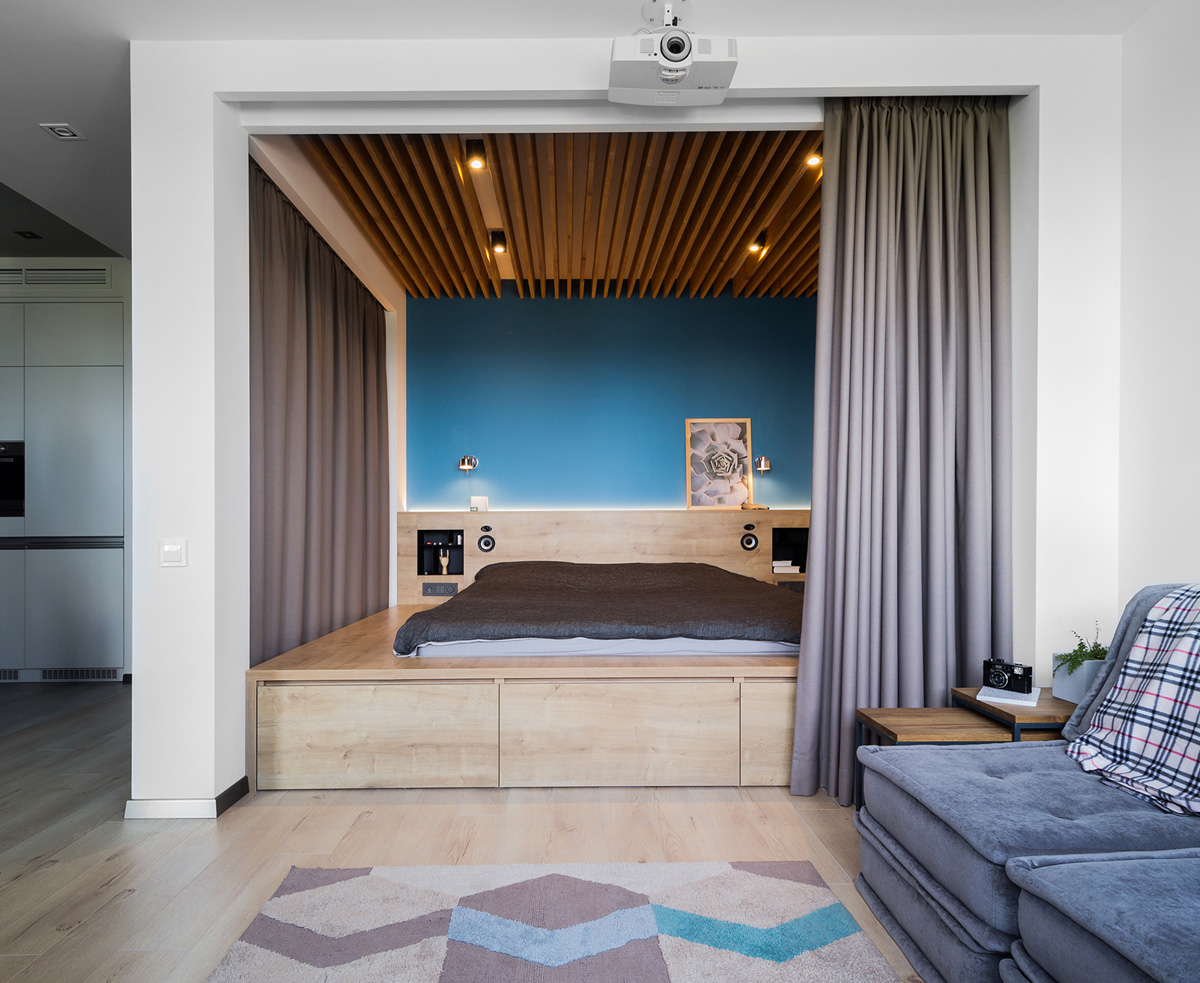современный дизайн гостиной с кроватью